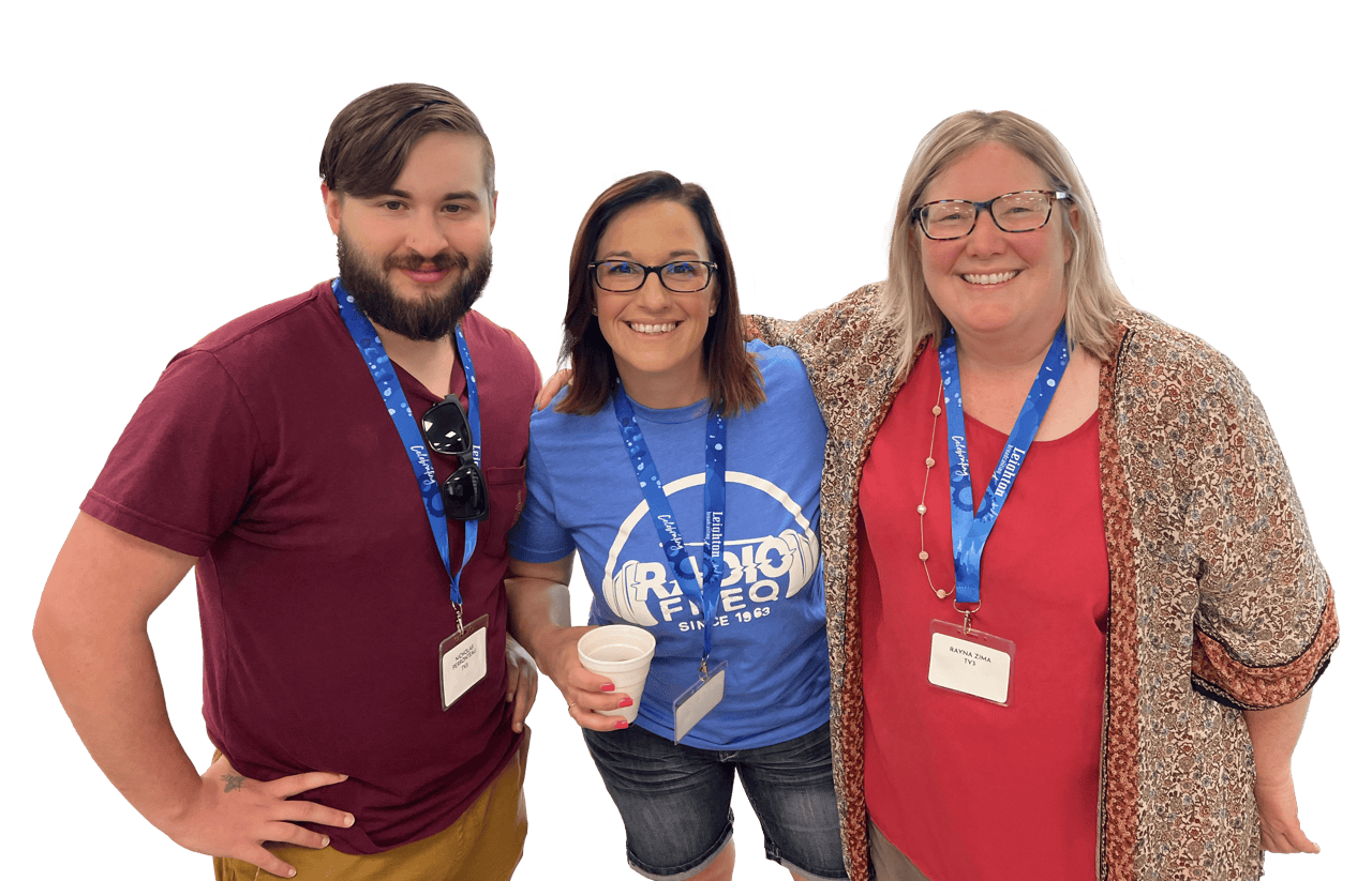 Three Leighton Media Employees Smiling Together